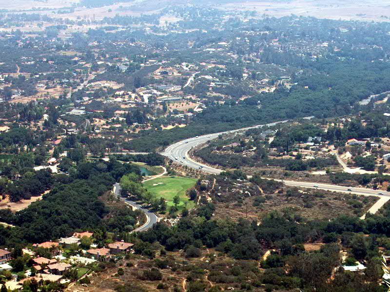 Ramona homes and State Route 67 winding through the valley