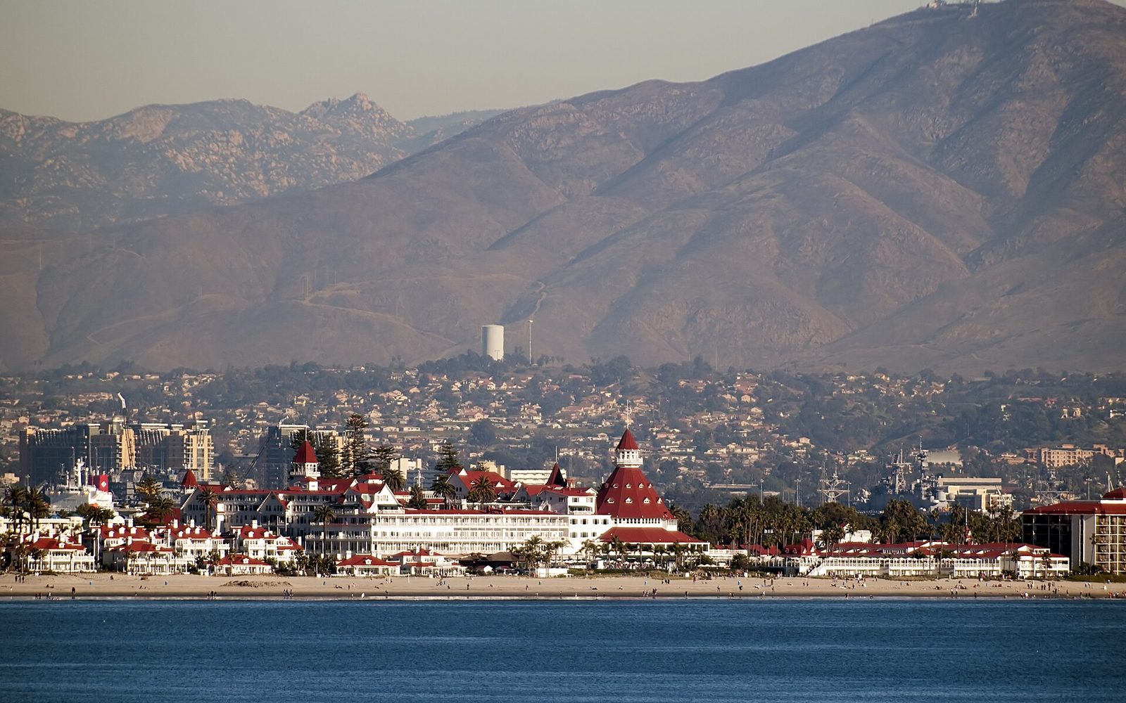 Hotel del Coronado on Coronado Island with mountains behind